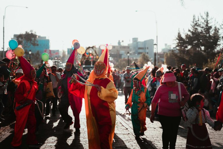 Colorful carnival celebration with performers in costumes parading through Arequipa streets.