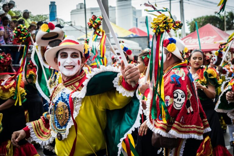 Colorful dancers in traditional costumes celebrate during the Barranquilla Carnival parade.