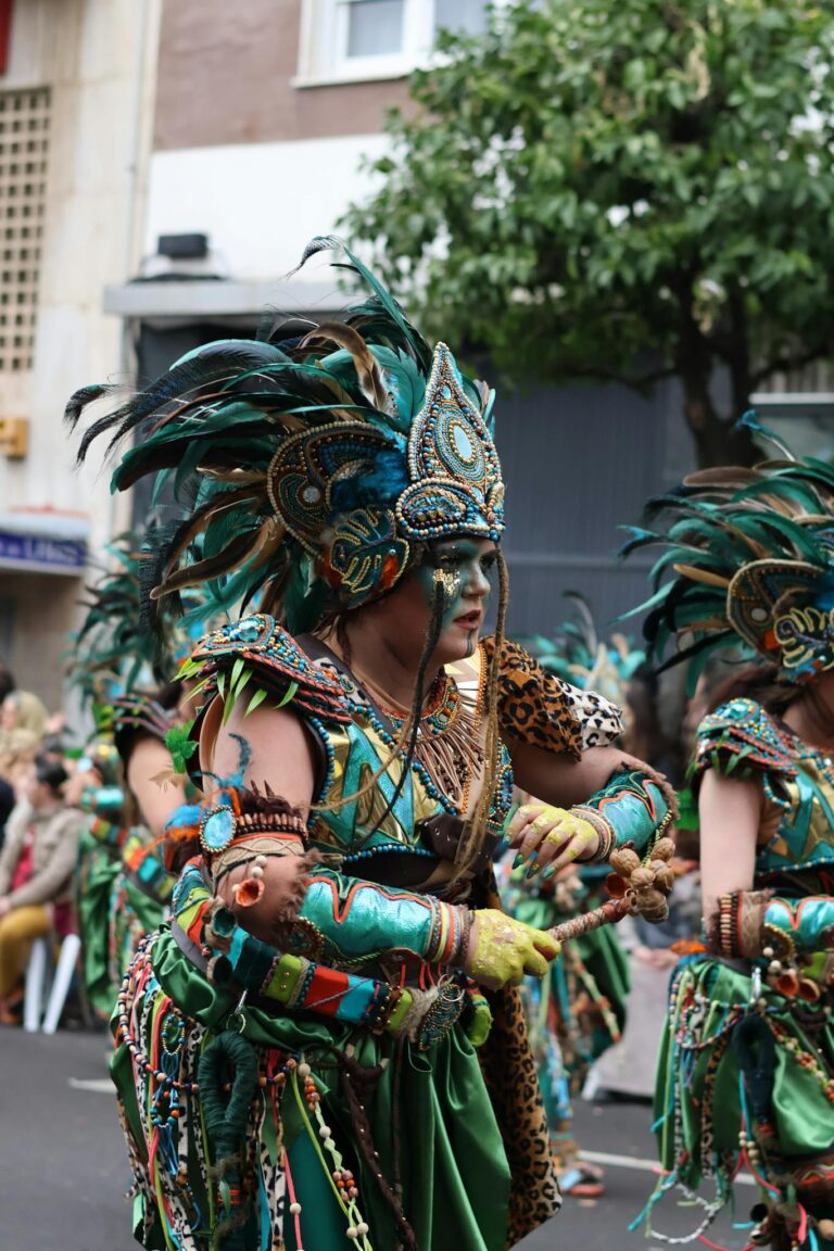 Colorfully costumed performers at Badajoz Carnival, showcasing rich cultural heritage.
